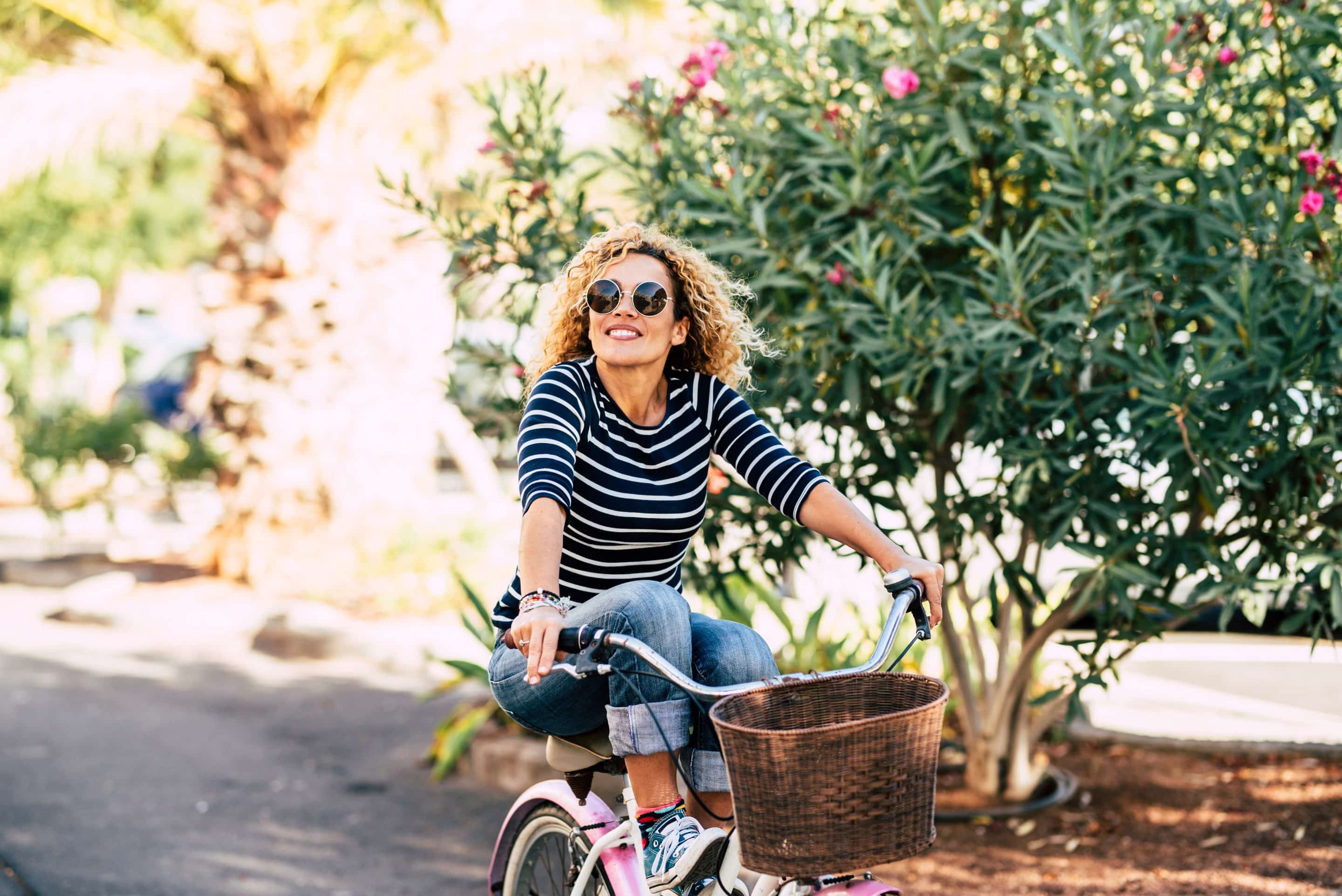 Woman on bike smiling