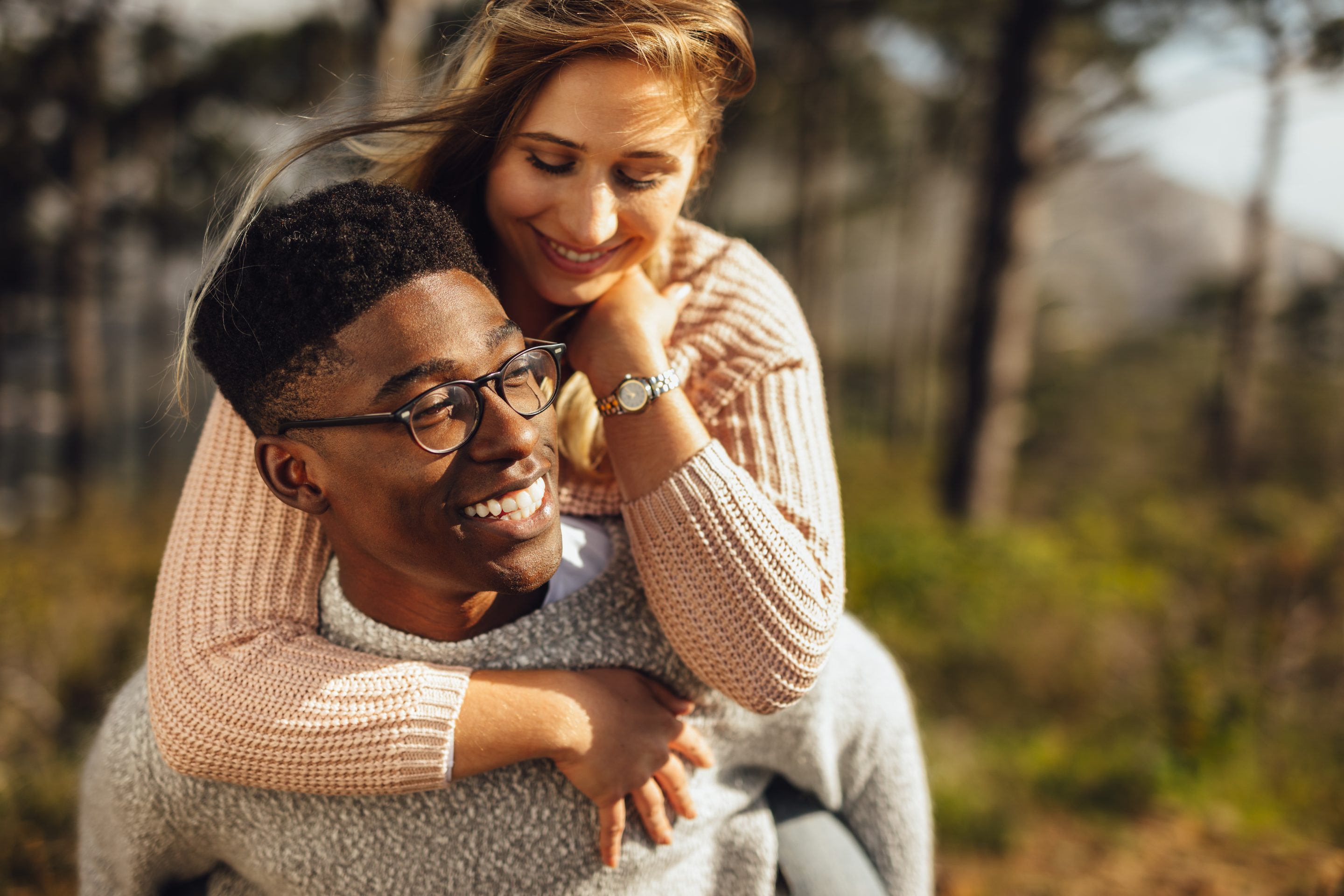 Couple outdoors with perfect smiles